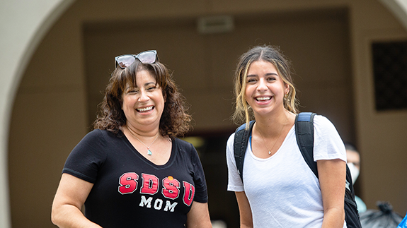 Mother and daughter smiling